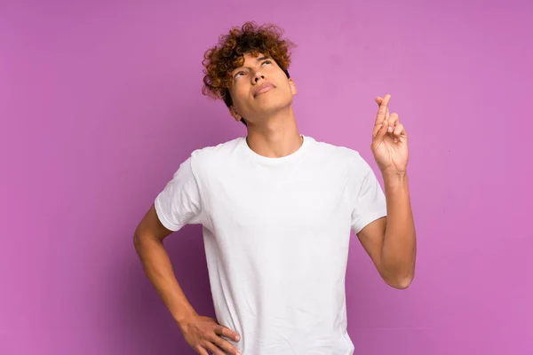 Young African American Man Isolated Purple Wall Fingers Crossing Wishing — Stock Photo, Image