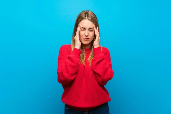 Woman Red Sweater Blue Wall Headache — Stock Photo, Image