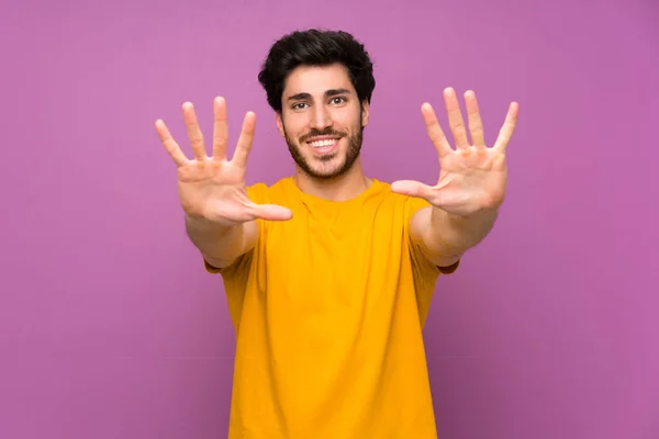 Handsome Isolated Purple Wall Counting Ten Fingers — Stock Photo, Image
