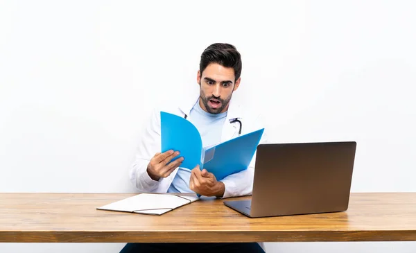 Young Doctor Man His Laptop Isolated Wall — Stock Photo, Image