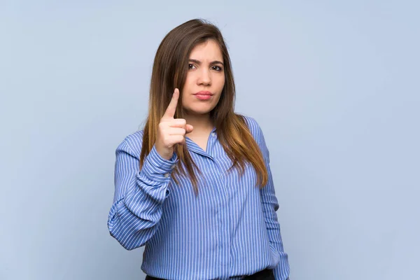 Young Girl Isolated Blue Wall Frustrated Pointing Front — Stock Photo, Image