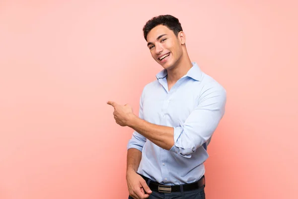 Handsome Man Pink Background Pointing Back — Stock Photo, Image