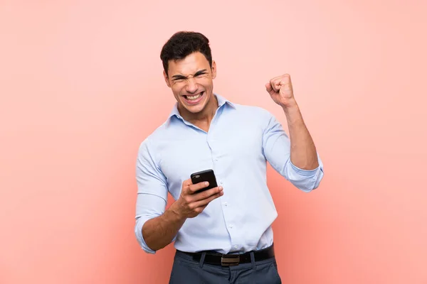 Handsome Man Pink Background Phone Victory Position — Stock Photo, Image