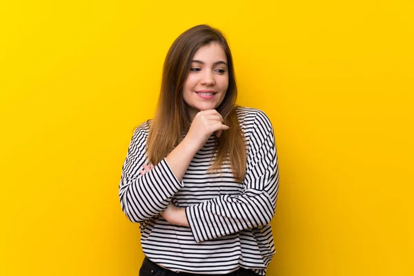 Young Girl Yellow Wall Looking Side — Stock Photo, Image