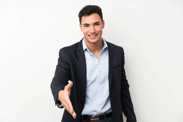 Knappe Man Geïsoleerde Witte Muur Handshaking Goede Deal — Stockfoto