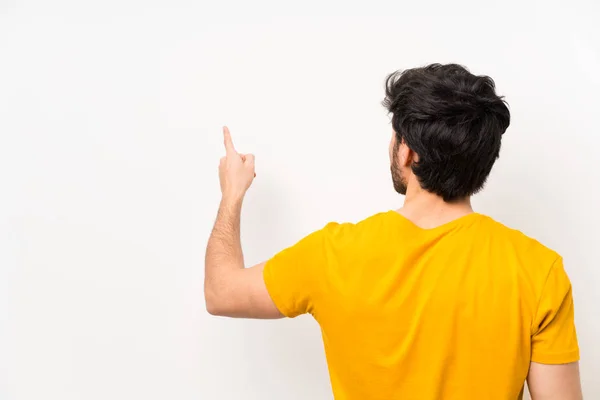 Knappe Geïsoleerde Witte Muur Wijst Terug Met Wijsvinger — Stockfoto