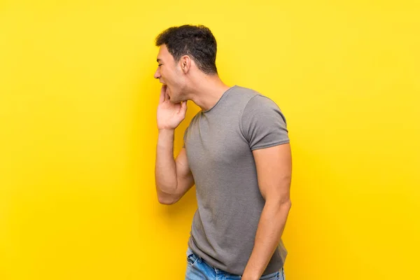 Handsome Man Isolated Yellow Wall Shouting Mouth Wide Open Lateral — Stock Photo, Image