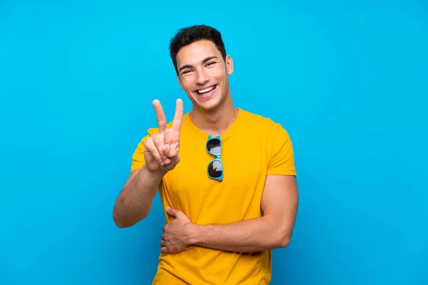 Handsome Man Blue Background Smiling Showing Victory Sign — Stock Photo, Image