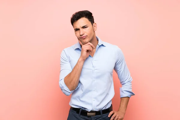 stock image Handsome man over pink background Looking front