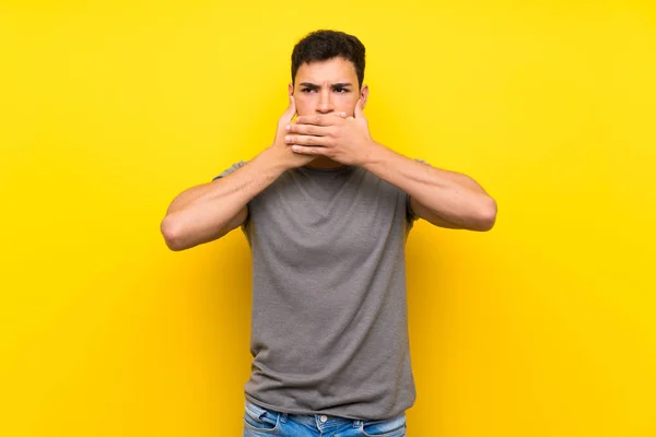 Handsome Man Isolated Yellow Wall Covering Mouth Hands — Stock Photo, Image