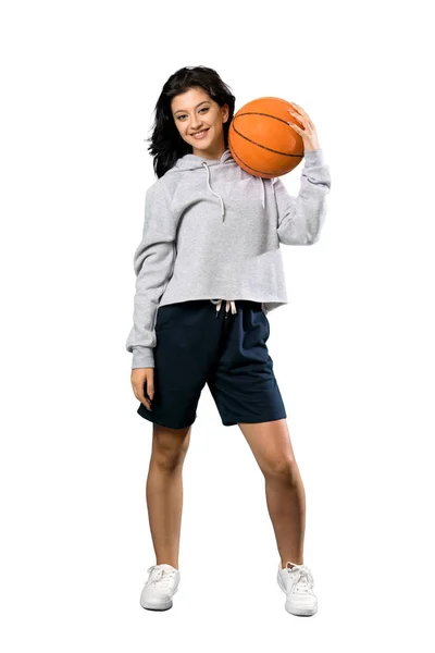 Νεαρή γυναίκα που παίζει μπάσκετ — Φωτογραφία Αρχείου