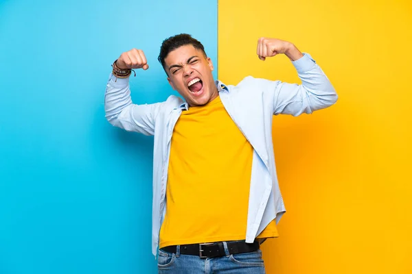 Young Man Isolated Colorful Background Celebrating Victory — Stock Photo, Image