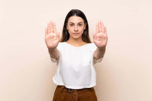 Joven Morena Sobre Fondo Aislado Haciendo Stop Gesture Decepcionado —  Fotos de Stock