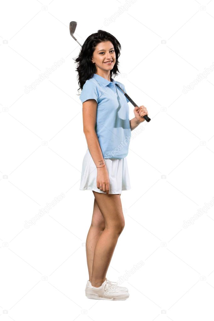 A full-length shot of a Young golfer woman smiling a lot over isolated white background