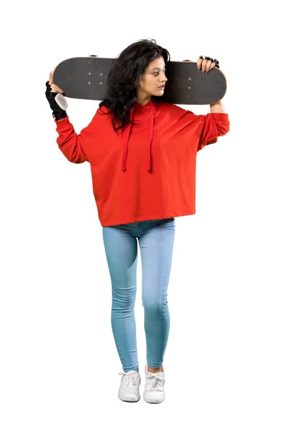 Young skater woman with red sweatshirt — Stock Photo, Image