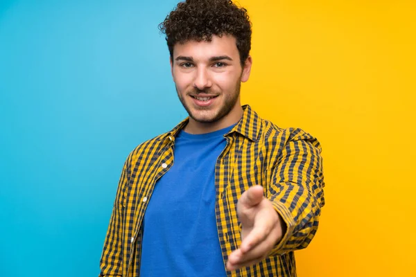 Man Curly Hair Colorful Wall Handshaking Good Deal — Stock Photo, Image