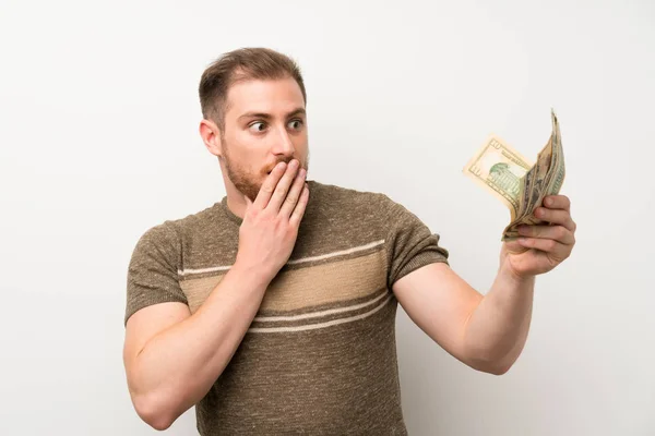 Hombre Guapo Sobre Pared Blanca Aislada Tomando Montón Dinero — Foto de Stock