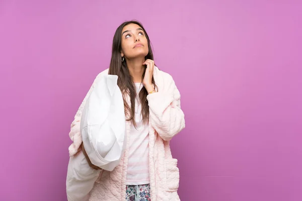 Young Woman Pajamas Dressing Gown Isolated Purple Background Thinking Idea — Stock Photo, Image