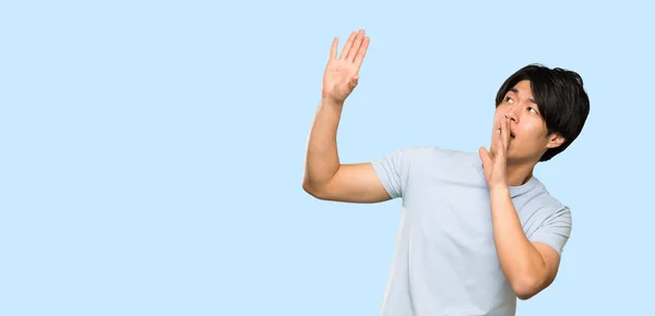 Asian Man Blue Shirt Nervous Scared Isolated Blue Background — Stock Photo, Image