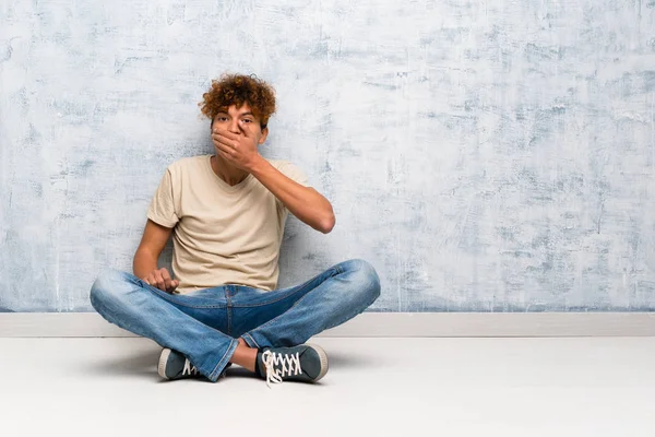 Young African American Man Sitting Floor Covering Mouth Hands — Stock Photo, Image