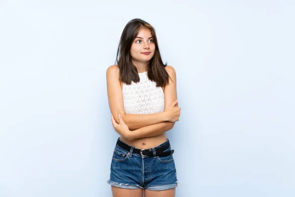Jonge Vrouw Geïsoleerde Blauwe Achtergrond Maken Twijfels Gebaar Terwijl Het — Stockfoto