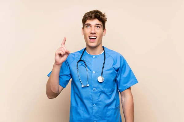 Surgeon Doctor Young Man Isolated Wall Intending Realizes Solution While — Stock Photo, Image