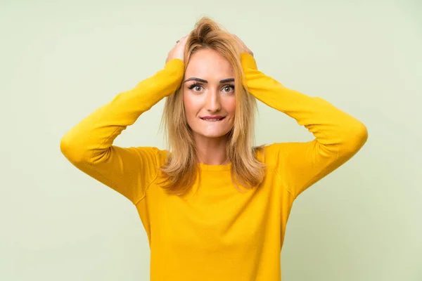 Young Blonde Woman Isolated Green Background Surprise Facial Expression — Stock Photo, Image