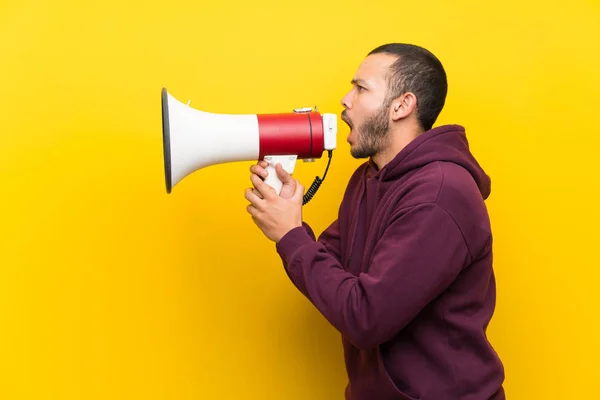 Colombian Man Sweatshirt Yellow Wall Shouting Megaphone — Stock Photo, Image