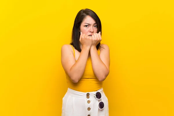 Young Mexican Woman Isolated Yellow Background Nervous Scared Putting Hands — Stock Photo, Image