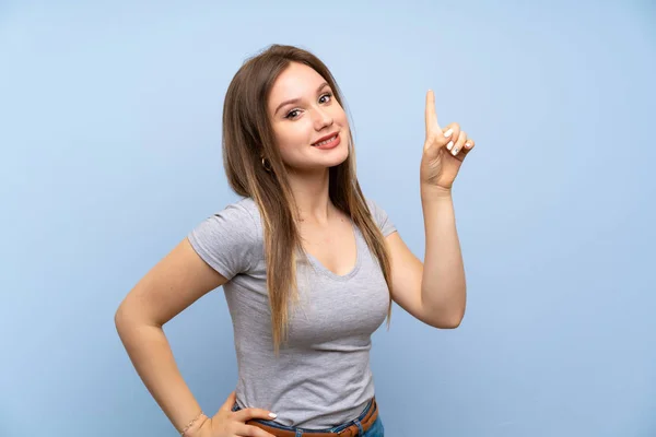 Adolescente Chica Sobre Aislado Azul Pared Mostrando Levantando Dedo Señal — Foto de Stock