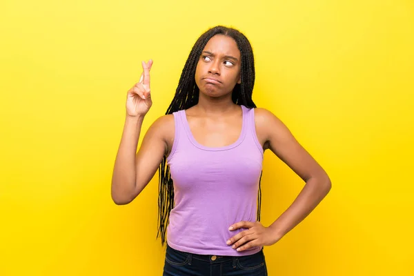 African American Teenager Girl Long Braided Hair Isolated Yellow Wall — Stock Photo, Image