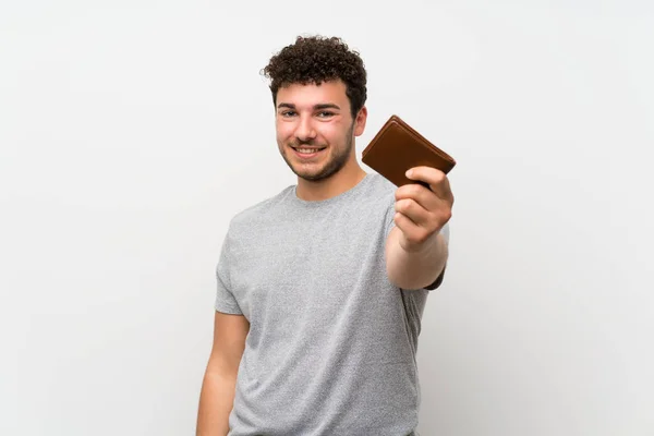 Muž Kudrnatými Vlasy Izolované Stěně Držící Peněženku — Stock fotografie