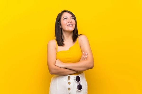 Young Mexican Woman Isolated Yellow Background Looking While Smiling — Stock Photo, Image