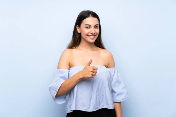 Young Brunette Woman Isolated Blue Background Giving Thumbs Gesture — Stock Photo, Image