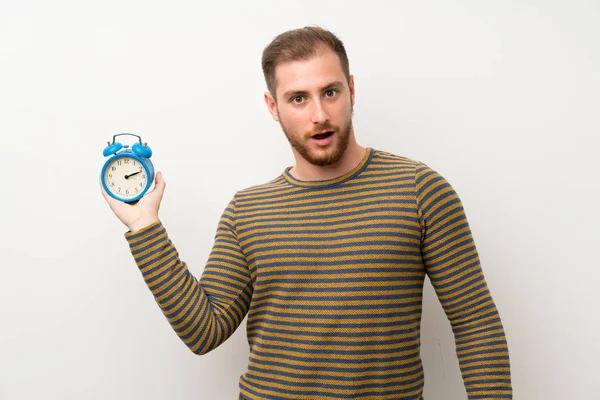 Handsome Man Isolated White Wall Holding Vintage Alarm Clock — Stock Photo, Image