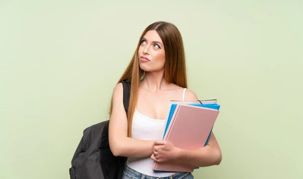 Ung Student Kvinna Över Isolerad Grön Bakgrund Tänkande Idé — Stockfoto