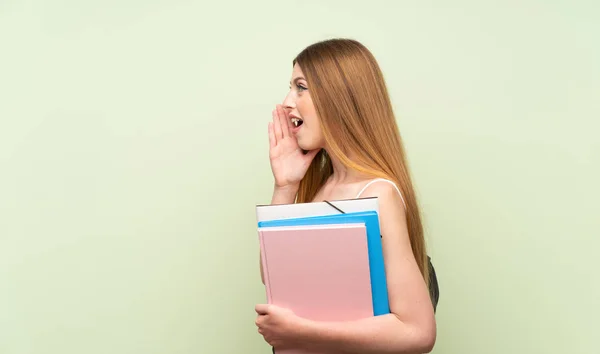 Young Student Woman Isolated Green Background Shouting Mouth Wide Open — Stock Photo, Image