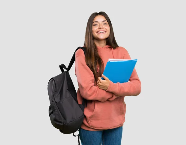 Jovem Estudante Segurando Cadernos Com Braços Cruzados Olhando Para Frente — Fotografia de Stock