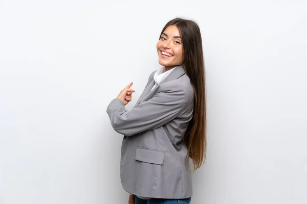 Jovem Mulher Negócios Sobre Isolado Fundo Branco Apontando Para Trás — Fotografia de Stock