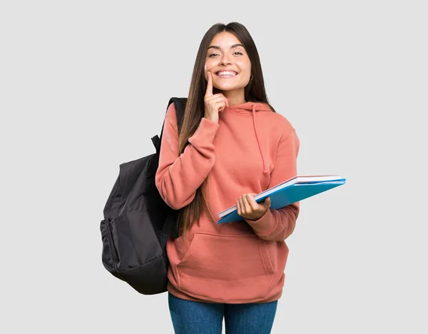 Jovem Estudante Segurando Cadernos Sorrindo Com Uma Expressão Feliz Agradável — Fotografia de Stock