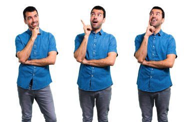 Mavi gömlek ayakta ve bir ide düşünme ile Yakışıklı adam Seti