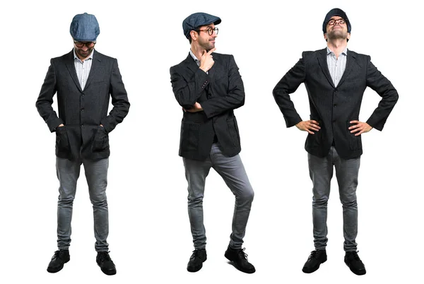 Set van knappe moderne man met baret en glazen staande en l — Stockfoto