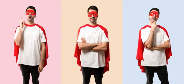 Set of Superhero man with mask and red cape keeping the arms cro