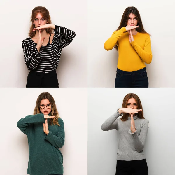 Set of women over white background making stop gesture with her hand to stop an act