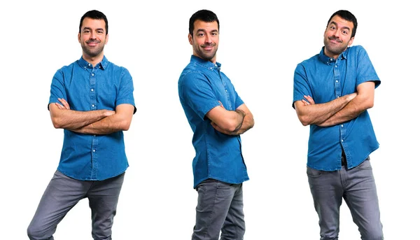 Set van knappe man met blauw shirt houden armen gekruiste — Stockfoto
