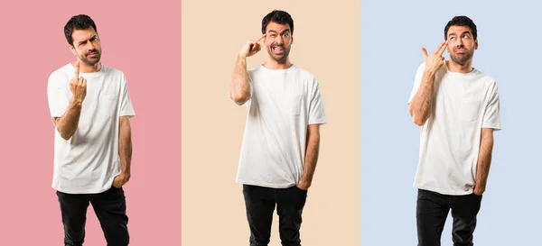 Conjunto de Joven con camisa blanca haciendo el gesto de la locura —  Fotos de Stock