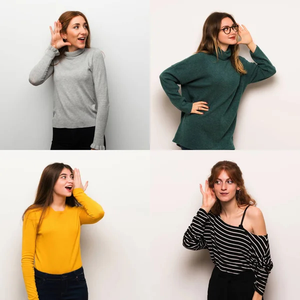 Set of women over white background listening to something by putting hand on the ear