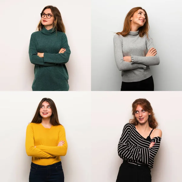 Set of women over white background looking up while smiling