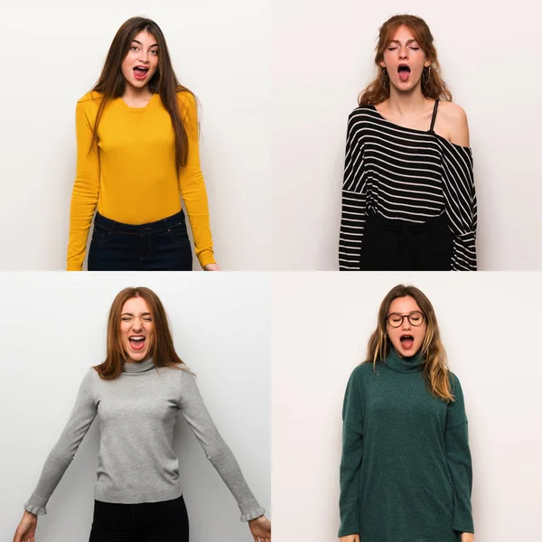 Set of women over white background shouting to the front with mouth wide open