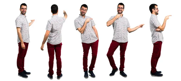 Set of Handsome man with glasses pointing to the lateral and bac — Stock Photo, Image